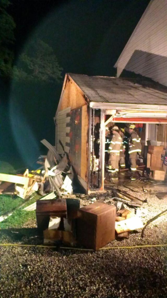 6/14/13 Garage fire on Harmony Grove Rd, quick thinking resident helped contain the fire to the garage only.  Photo by Larry Anderson